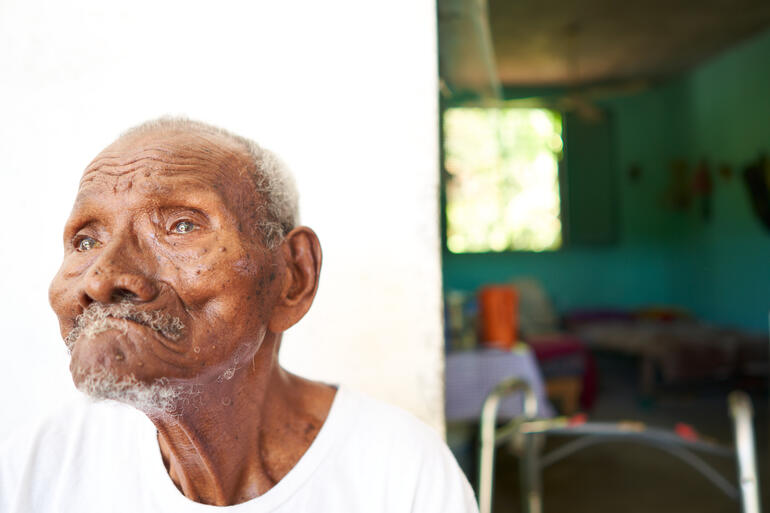 112-year-old Victoriano Ayona Corcuera sits outside his home in Collantes, Oaxaca.